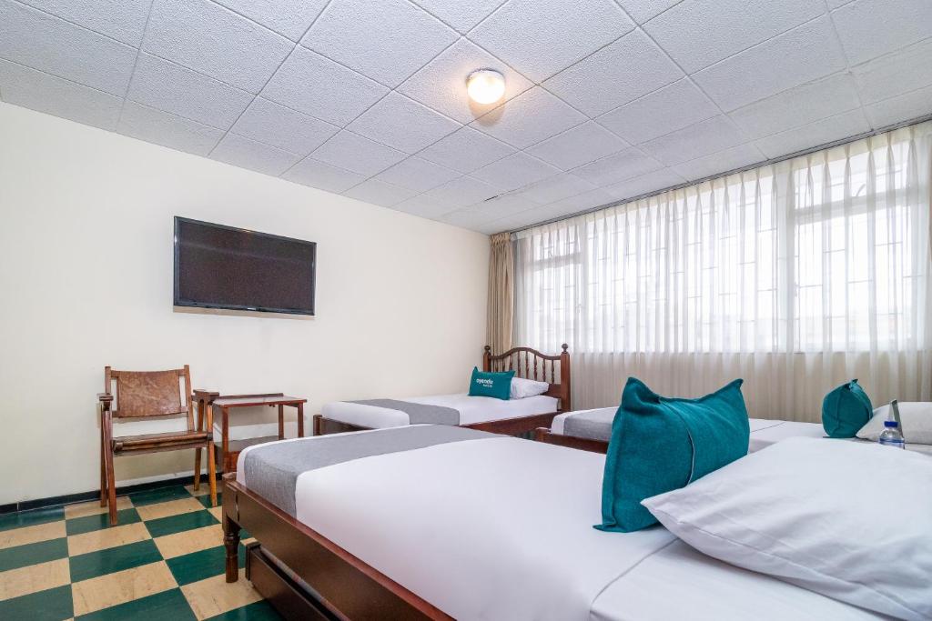 Postel nebo postele na pokoji v ubytování Casa Hostal Norte