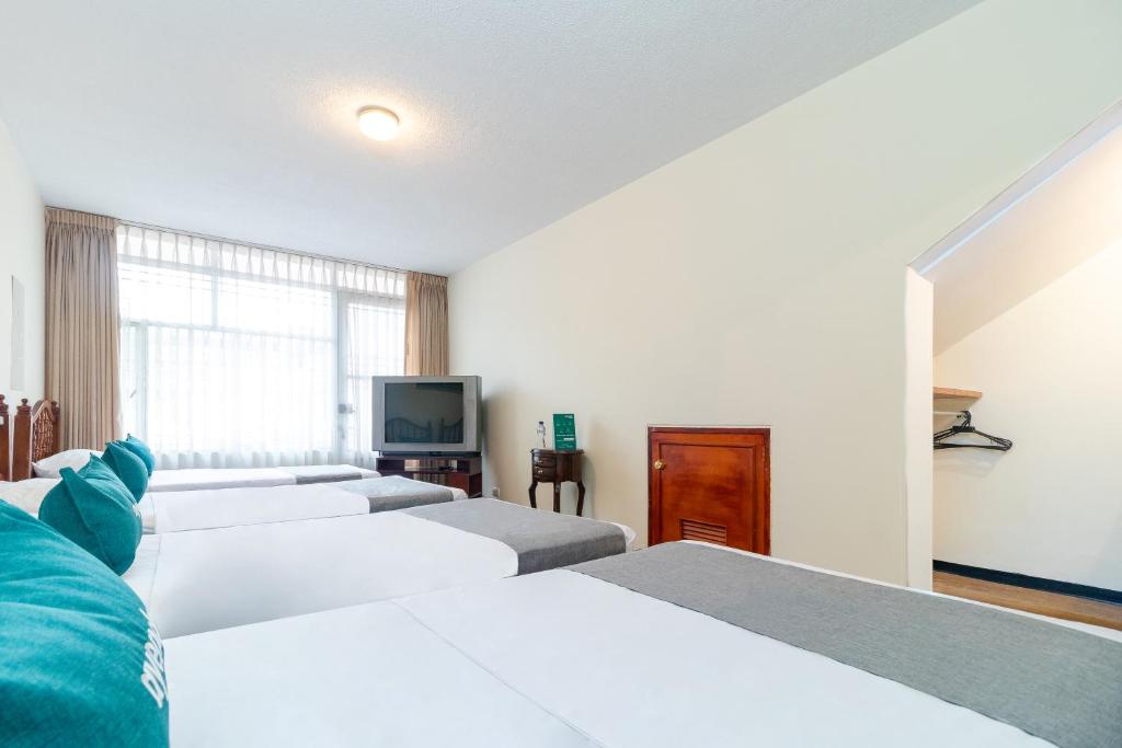 Postel nebo postele na pokoji v ubytování Casa Hostal Norte