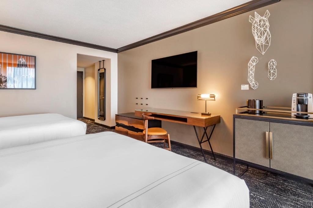 Postel nebo postele na pokoji v ubytování Omni Austin Hotel Downtown