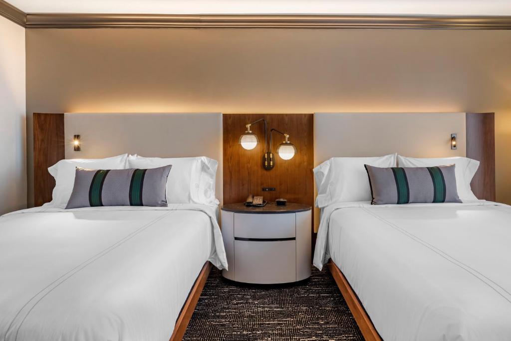 Postel nebo postele na pokoji v ubytování Omni Austin Hotel Downtown