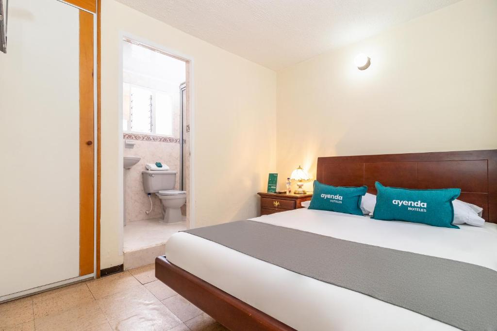 Postel nebo postele na pokoji v ubytování Casa Hostal Norte