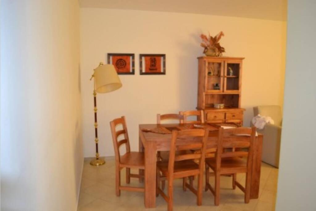 a dining room with a wooden table and chairs at Mendoza departamento Chile 1358 in Mendoza