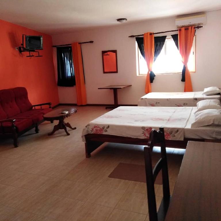 Postel nebo postele na pokoji v ubytování Residencial Laginha