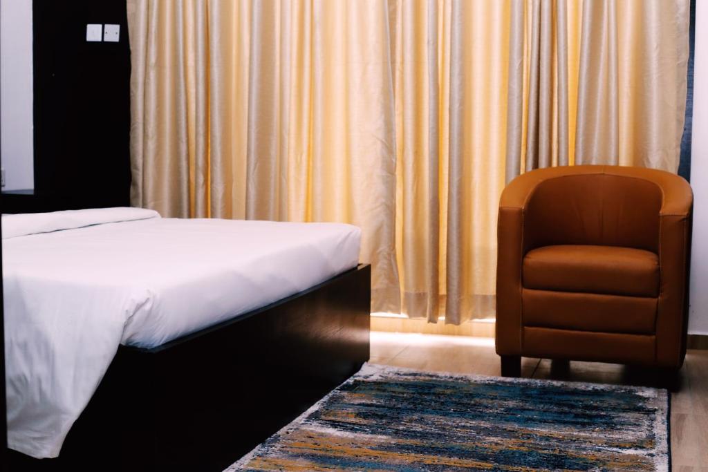 Postel nebo postele na pokoji v ubytování Hotel Capitol