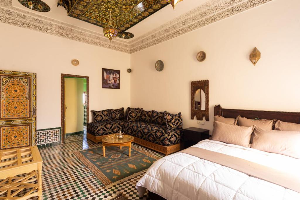 Llit o llits en una habitació de Riad Sayeda Al Hora