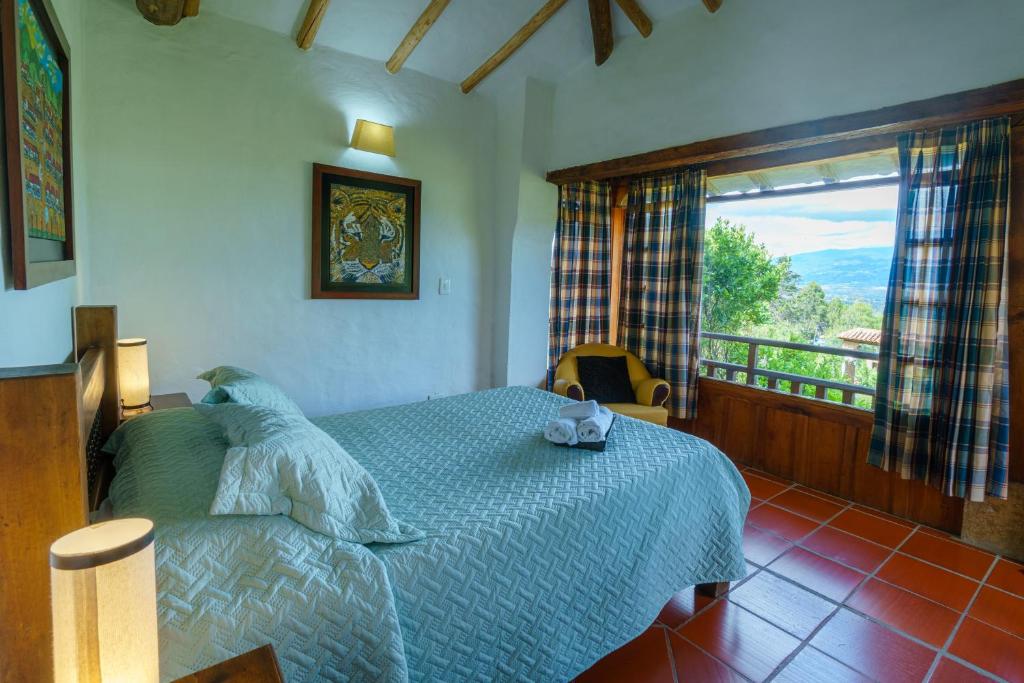 Postel nebo postele na pokoji v ubytování Hostal Renacer