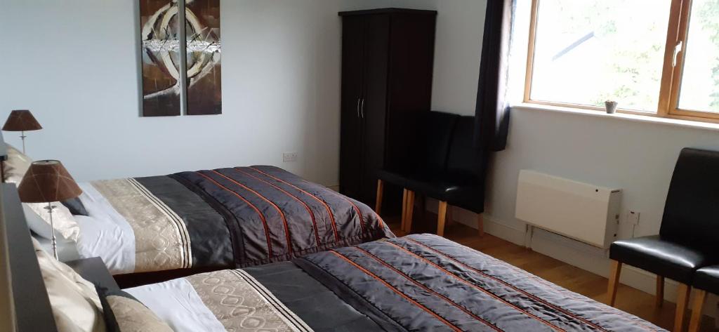 Postel nebo postele na pokoji v ubytování Alverna House B&B
