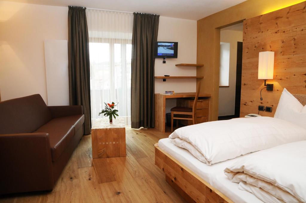 Postel nebo postele na pokoji v ubytování Hotel Olaga