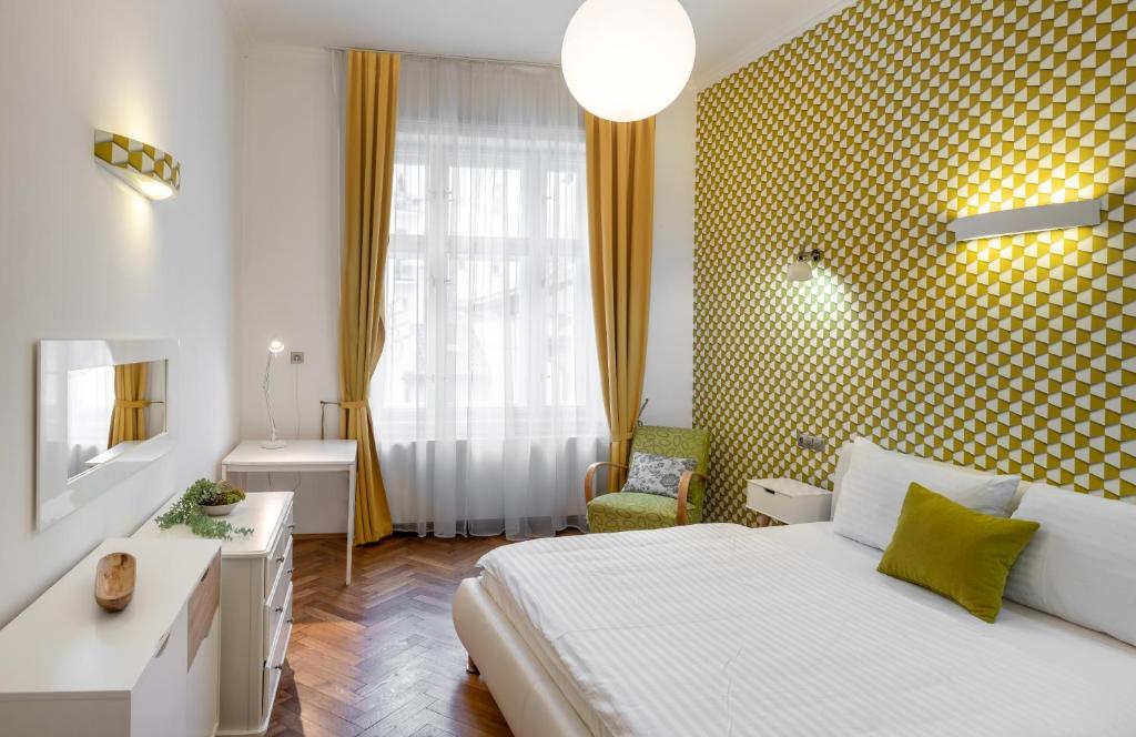 Łóżko lub łóżka w pokoju w obiekcie Mordecai 12 Apartments by Adrez