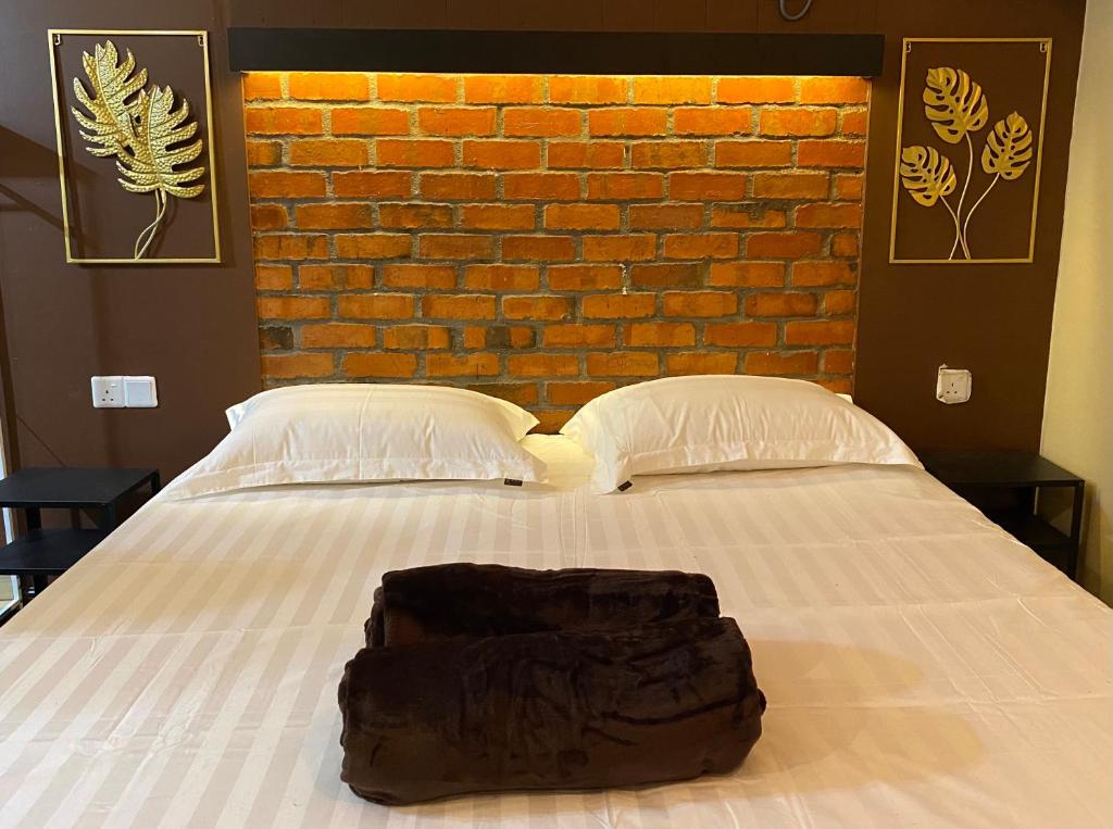 Postel nebo postele na pokoji v ubytování Grand Lodge Langkawi