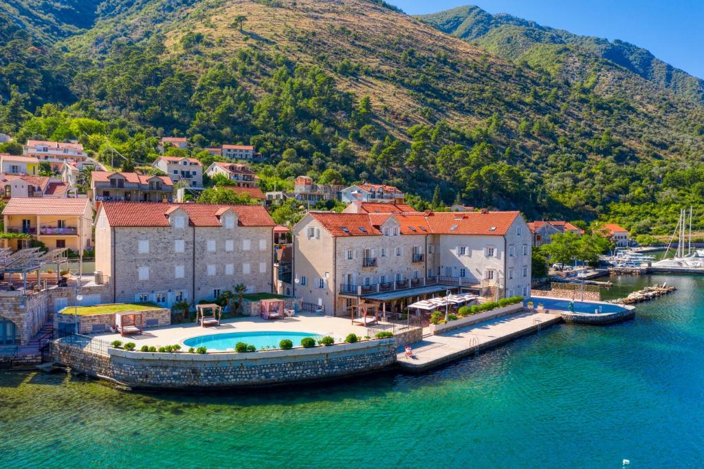 an aerial view of a town on a body of water at Hotel Splendido in Kotor