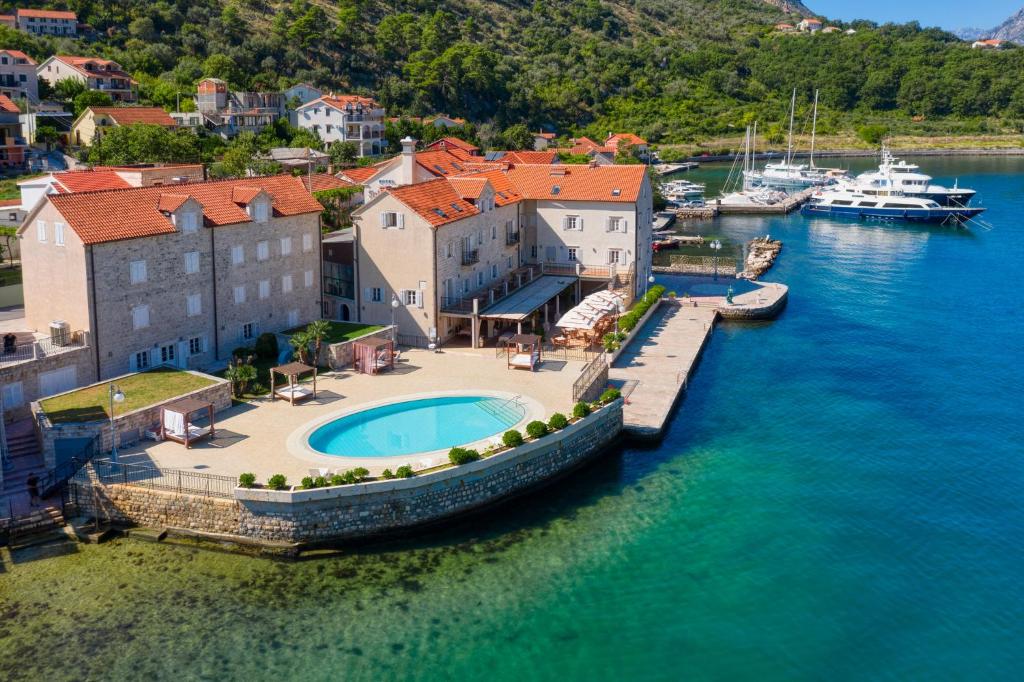 an aerial view of a harbor with boats in the water at Hotel Splendido in Kotor