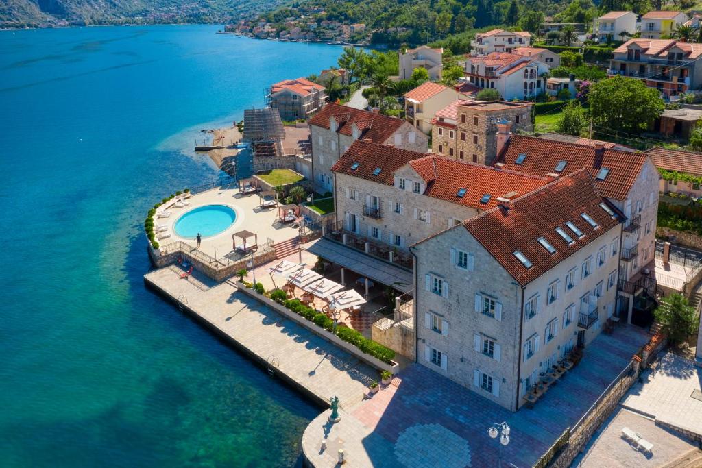 an aerial view of a building next to the water at Hotel Splendido in Kotor