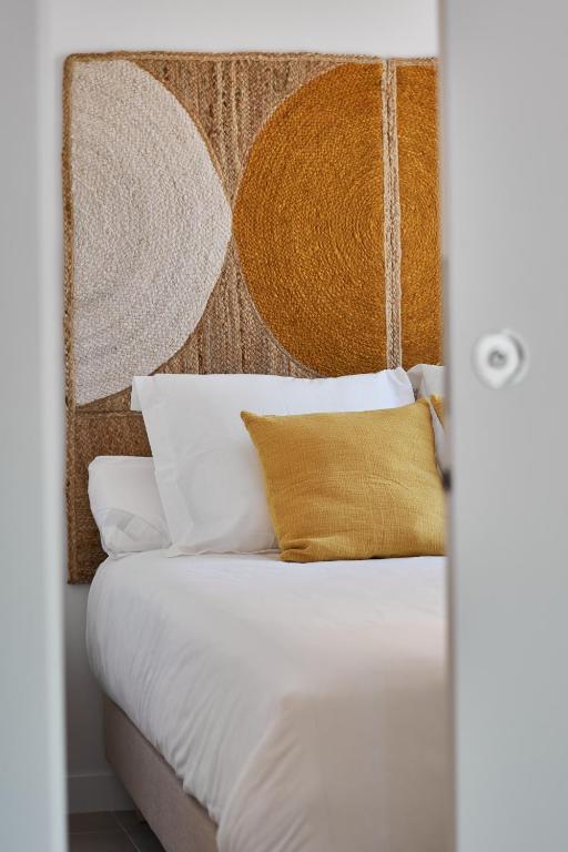Postel nebo postele na pokoji v ubytování Slow Home Apartments