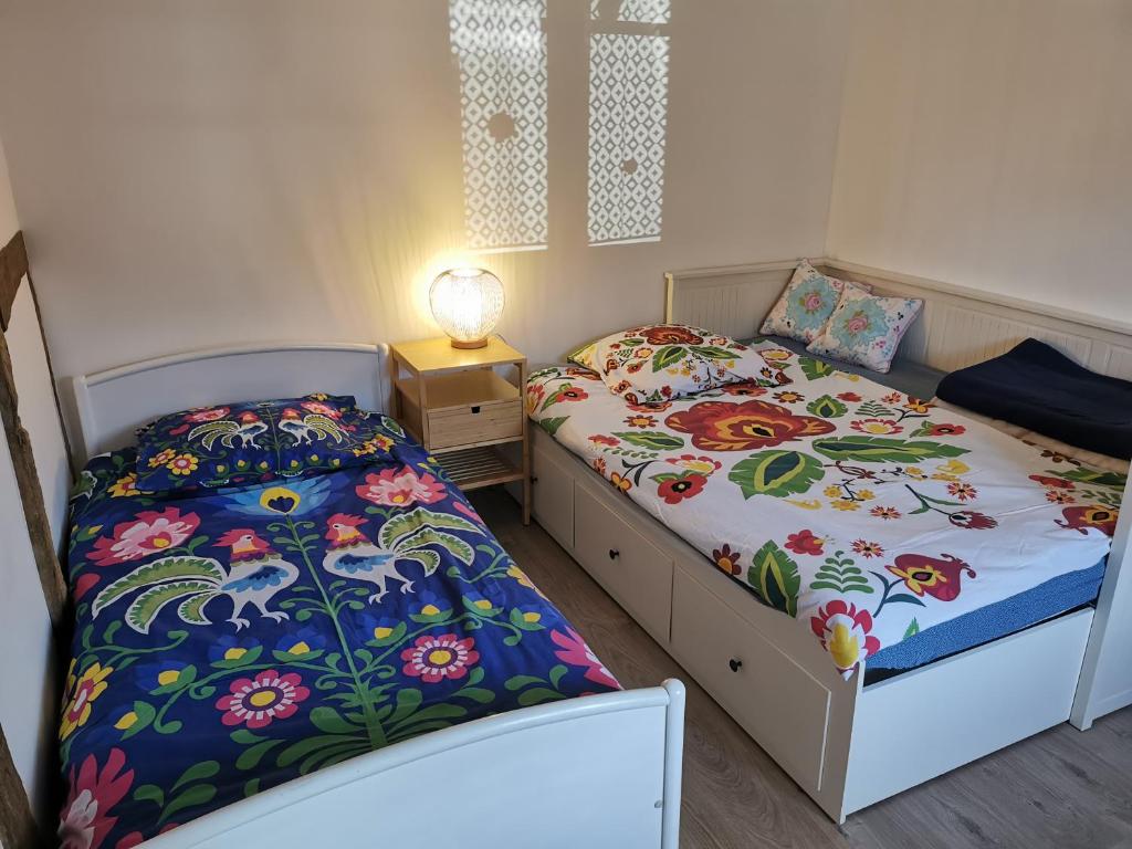 Postel nebo postele na pokoji v ubytování Une Maison à Colombages - Cosy, Lumineuse et Sauna