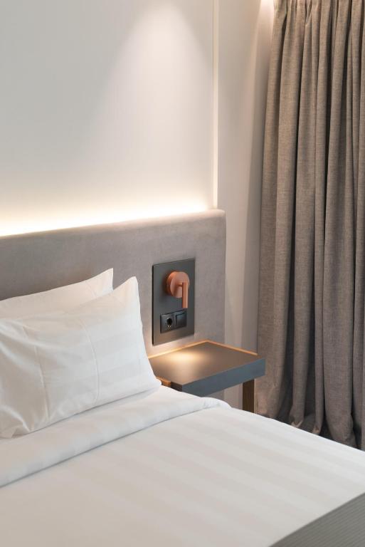 Postel nebo postele na pokoji v ubytování The Residences Kalamata