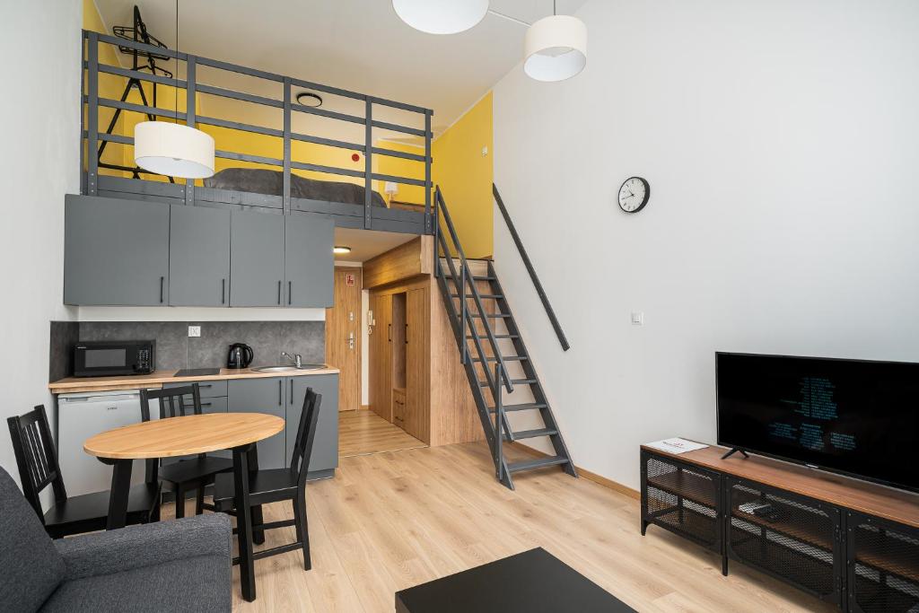 Televízia a/alebo spoločenská miestnosť v ubytovaní RentPlanet - Apartamenty Zarembowicza II