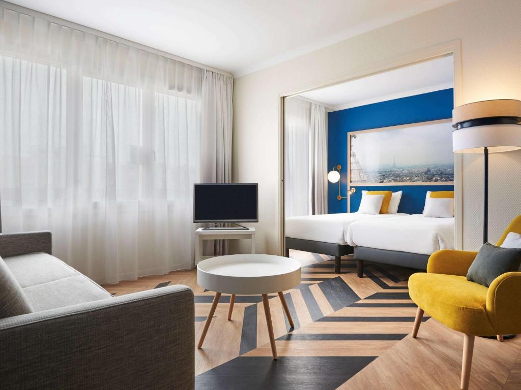 TV a/nebo společenská místnost v ubytování Aparthotel Adagio Porte de Versailles