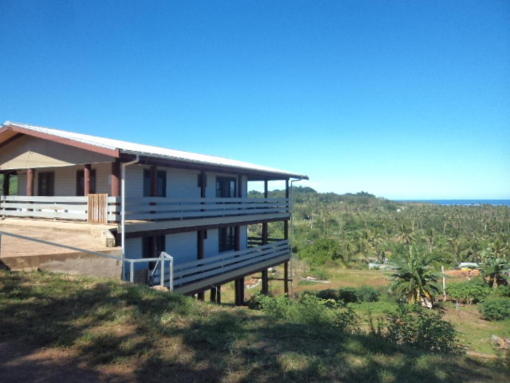 a house on the side of a hill at Impeccable 1 Bedroom 4 unit Apartment in Savusavu in Savusavu
