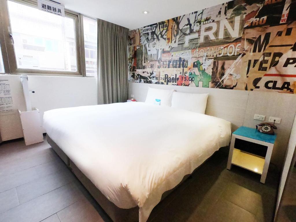 Postel nebo postele na pokoji v ubytování Wholesome Hotel