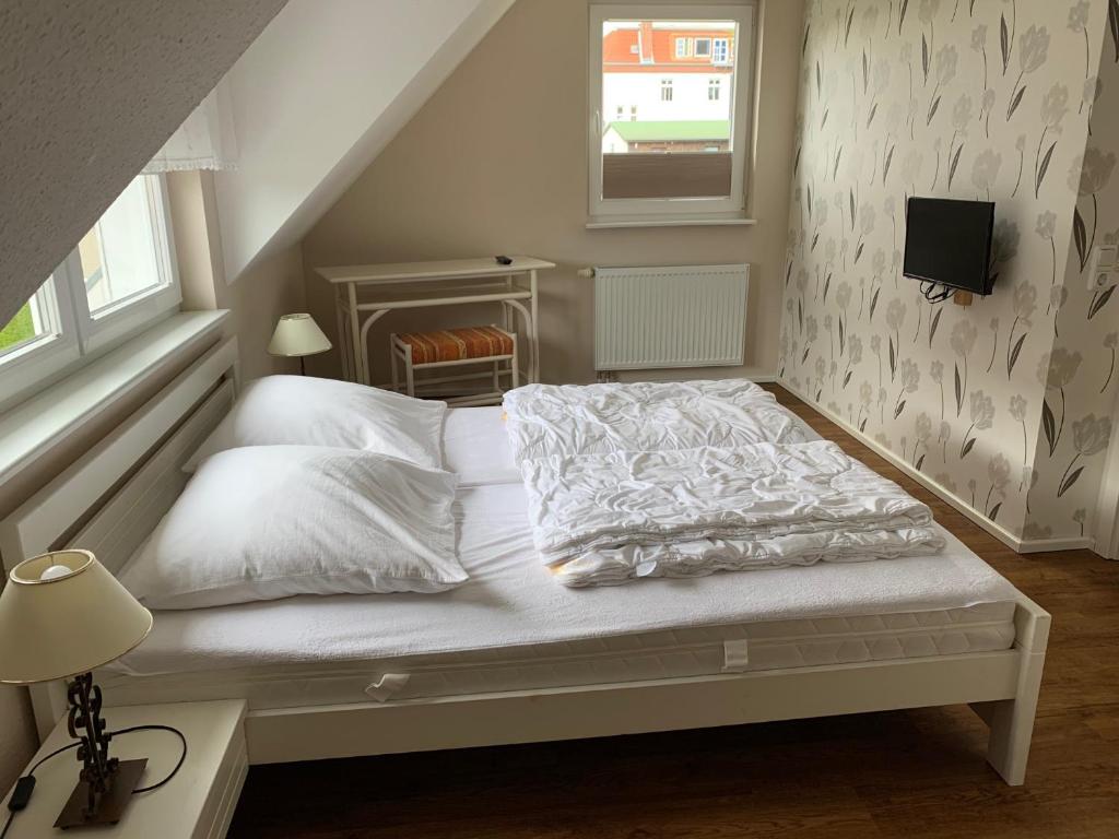 Postel nebo postele na pokoji v ubytování Ferienhaus Ankerplatz