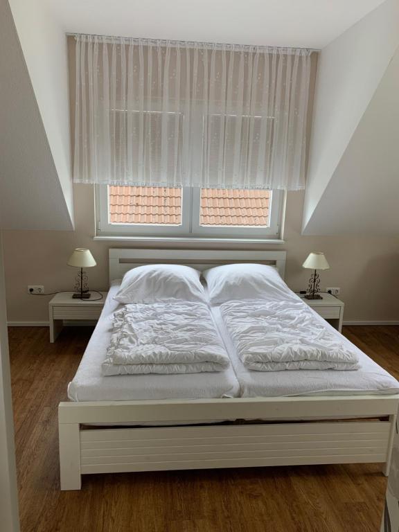 Postel nebo postele na pokoji v ubytování Ferienhaus Ankerplatz