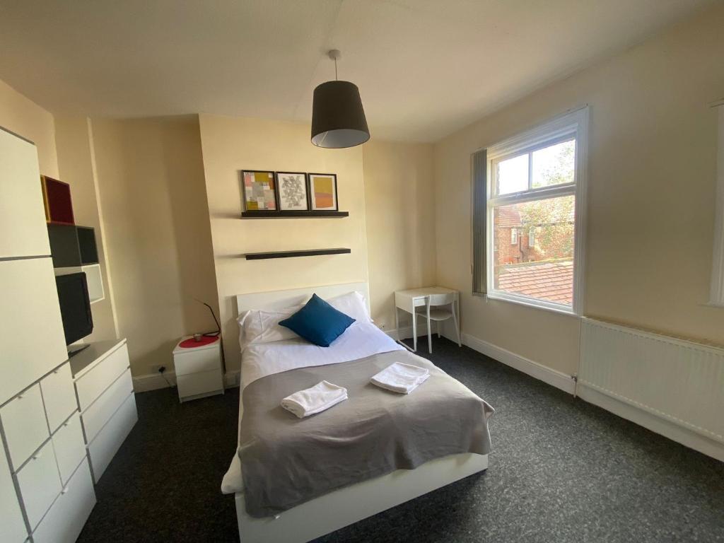 Postel nebo postele na pokoji v ubytování Abbeyfield Guesthouse
