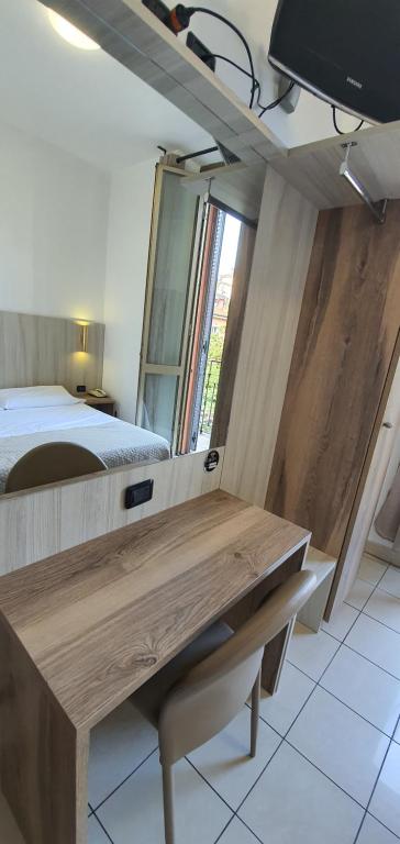 Postel nebo postele na pokoji v ubytování Hotel Mondial