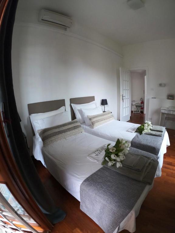 A bed or beds in a room at EMI's Guest House