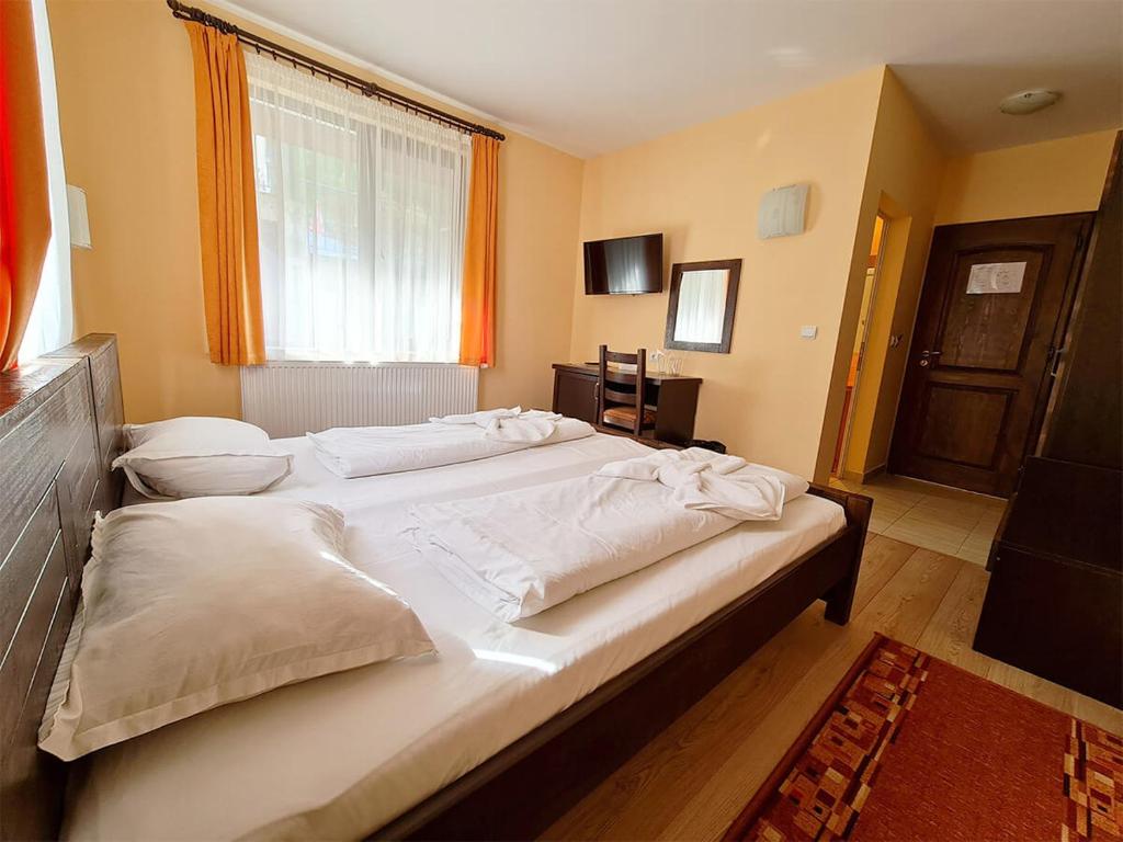 Postel nebo postele na pokoji v ubytování Family Hotel Chiflik Hills