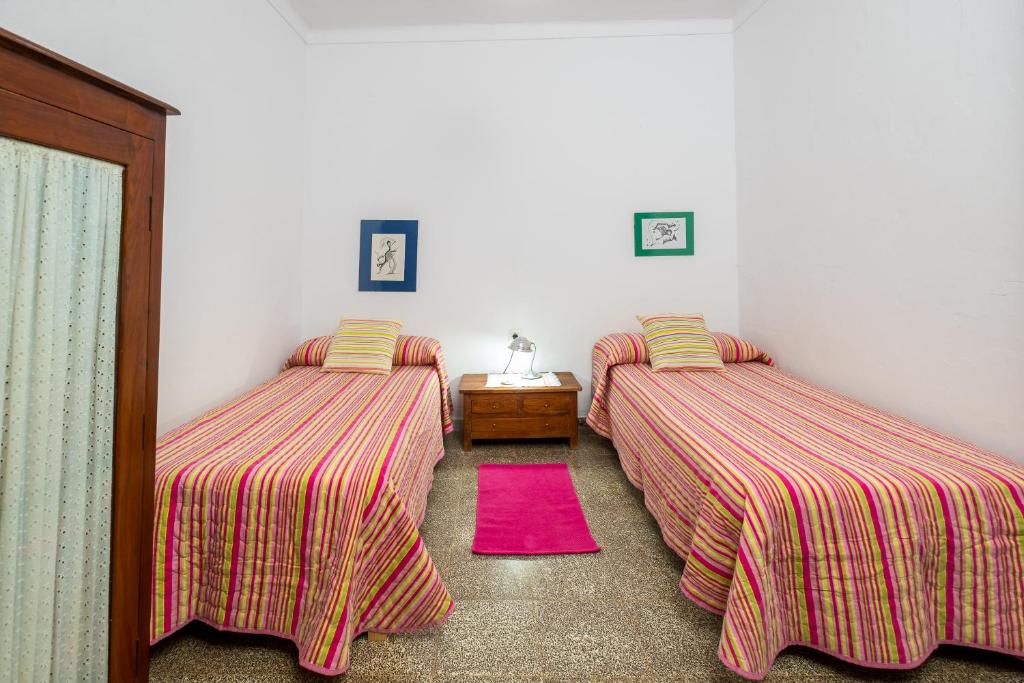 Postel nebo postele na pokoji v ubytování Casa de María