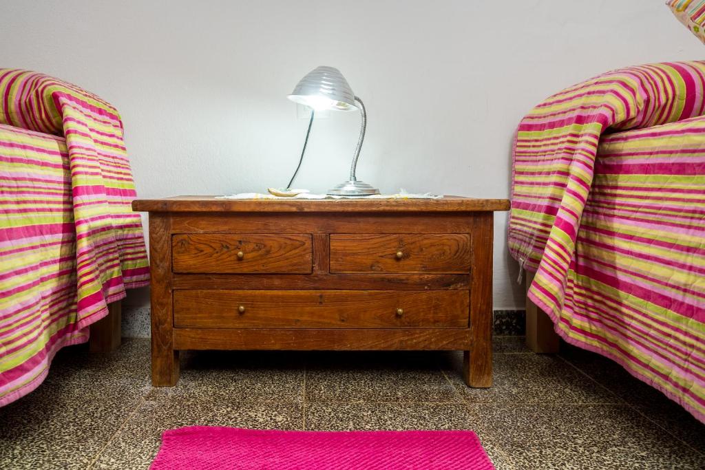 Postel nebo postele na pokoji v ubytování Casa de María