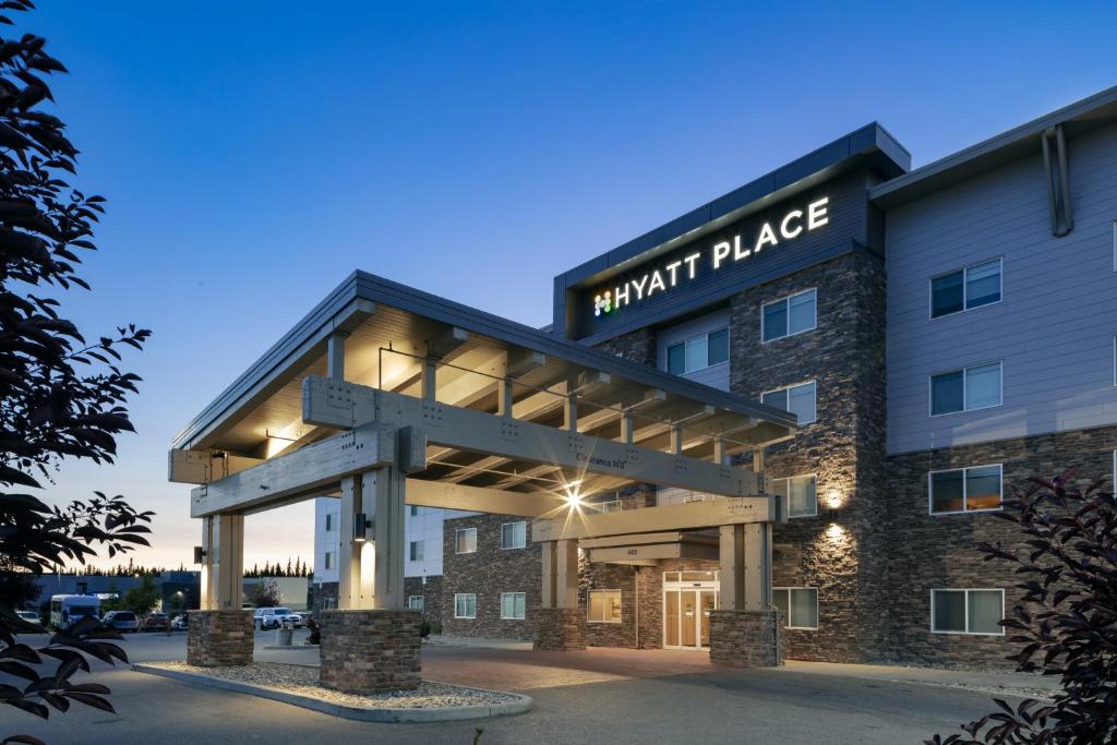 a large building with a clock on the front of it at Hyatt Place Fairbanks in Fairbanks