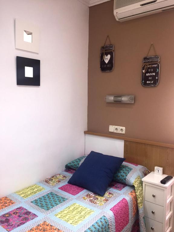 Una cama o camas en una habitación de Alojamiento Jaén