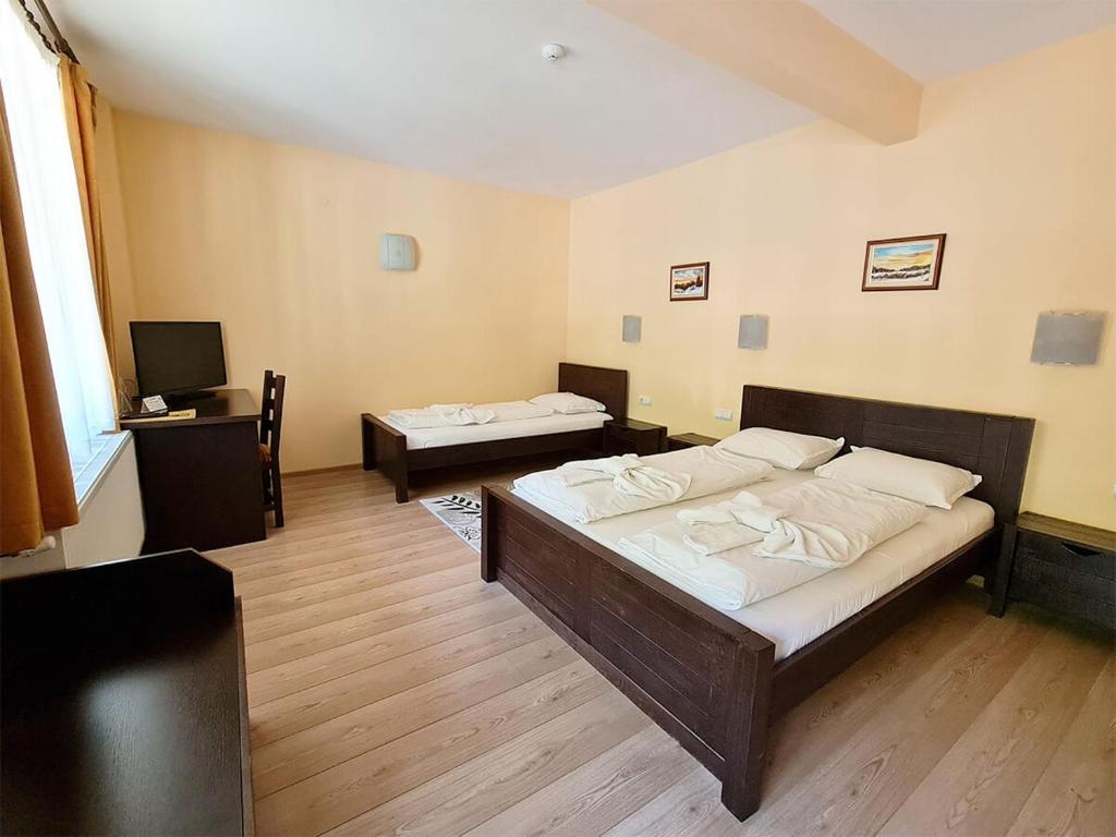 Postel nebo postele na pokoji v ubytování Family Hotel Chiflik Hills