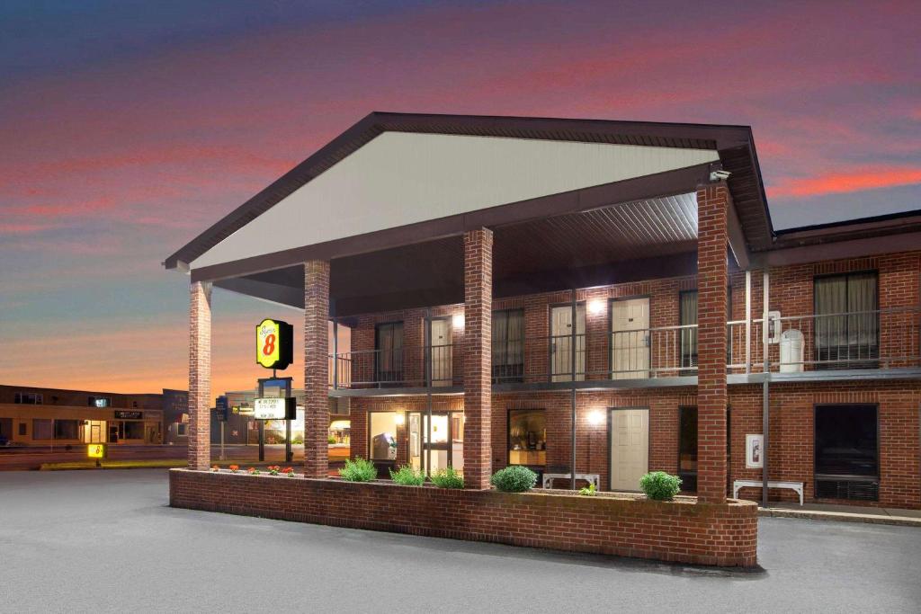 a rendering of a building with a traffic light at Super 8 by Wyndham Sandusky in Sandusky