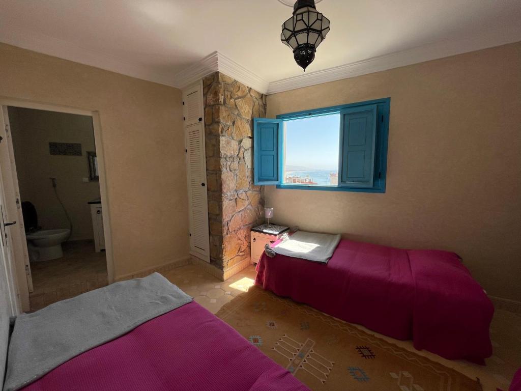 Postel nebo postele na pokoji v ubytování Taghazout Ocean View