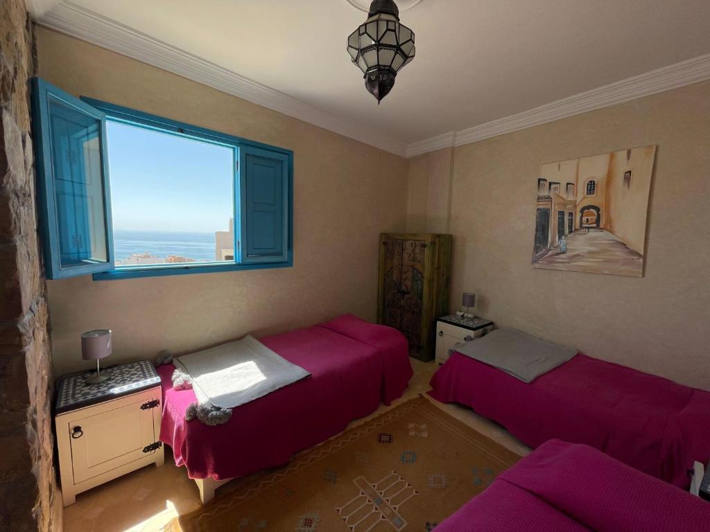 Postel nebo postele na pokoji v ubytování Taghazout Ocean View