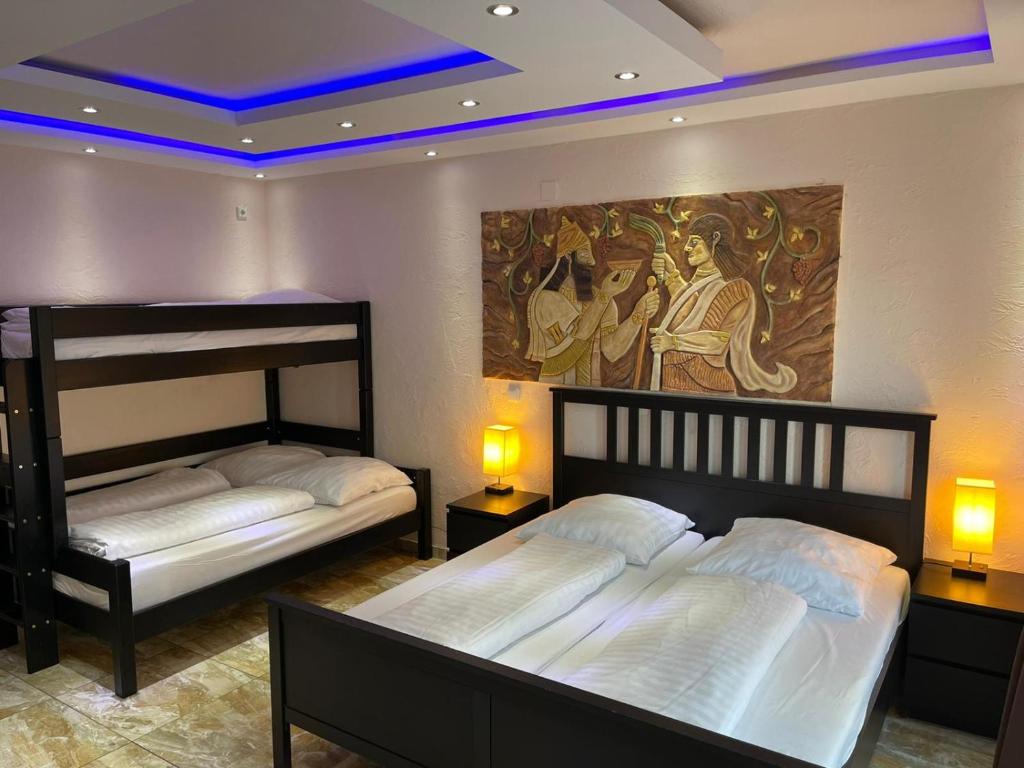 Postel nebo postele na pokoji v ubytování Hotel Babylon am Europa-Park
