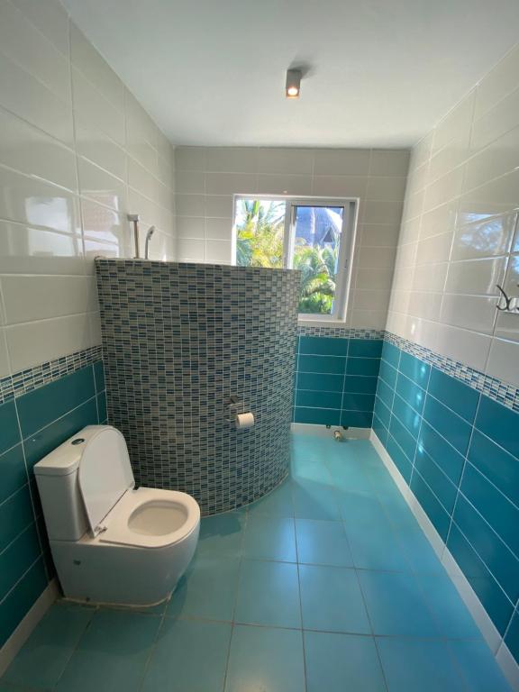 Koupelna v ubytování MASKANI Villa