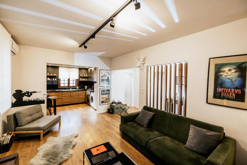 a living room with a couch and a table at Fort D-Val luxurious apartment in Angistron