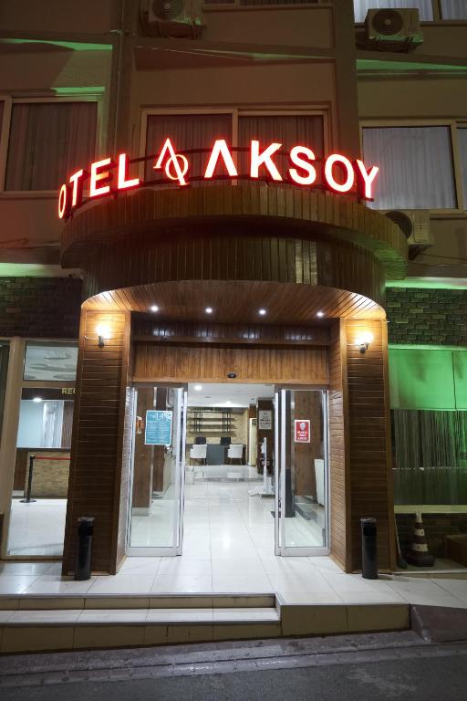 an entrance to a building with a sign on it at Aksoy Otel in Adana