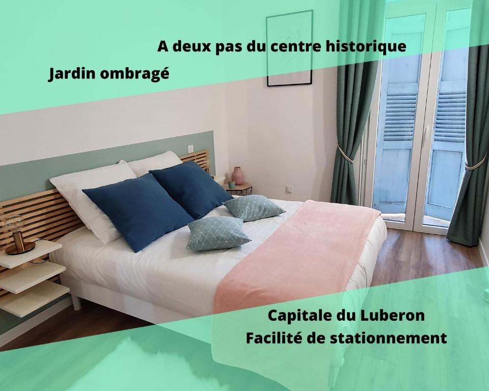 a poster of a bedroom with a bed with blue pillows at Lavandul'Apt in Apt