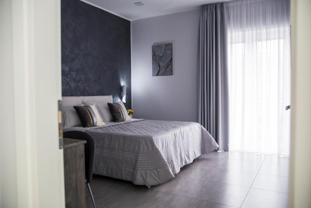 Posteľ alebo postele v izbe v ubytovaní Maison de Julia Pompei
