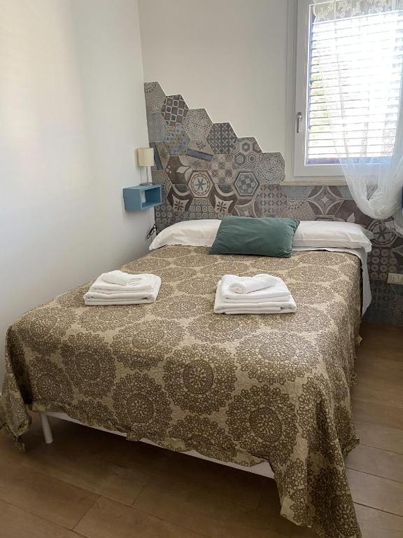A bed or beds in a room at Casa vacanze Almàsalo
