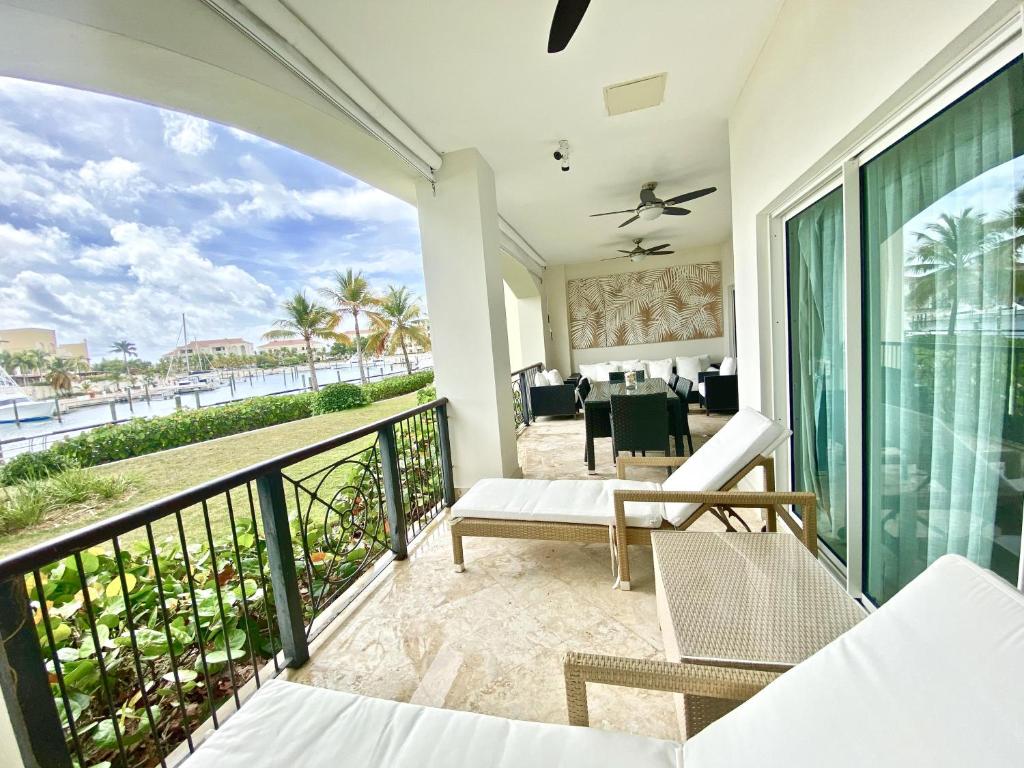 a balcony with a view of the ocean at Luxury Marina Front Condo Cap Cana, Punta Cana in Punta Cana