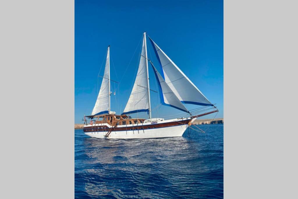 a boat with two sails on the water at Barco clásico en Barcelona in Sant Adria de Besos