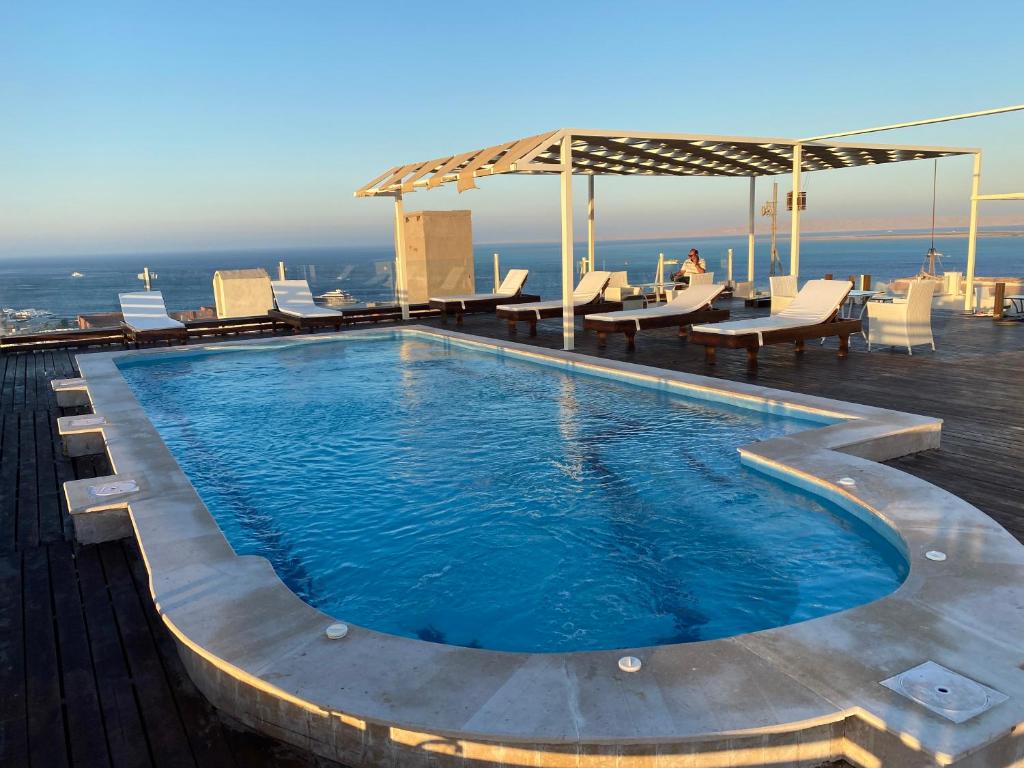 a swimming pool on the roof of a building at Charbel apartments in Hurghada