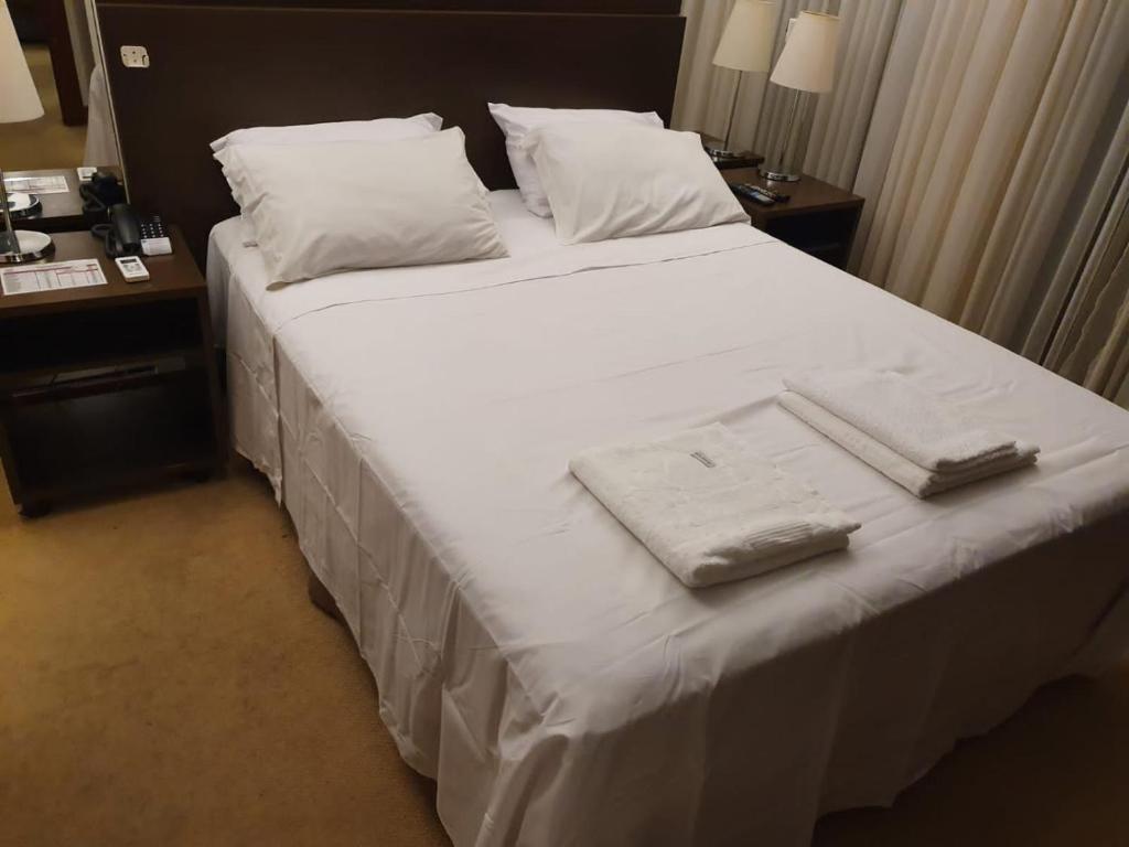 Tempat tidur dalam kamar di Bonaparte Hotel Flat Particular