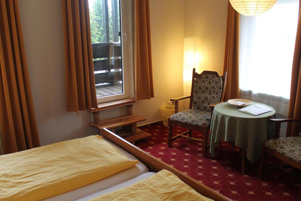 Postel nebo postele na pokoji v ubytování Hotel Carlsruh
